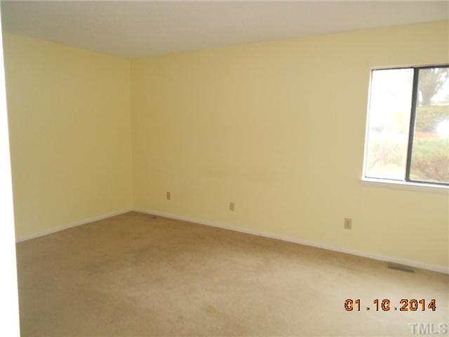 7617 Bryna Court Raleigh, NC 27615 - Photo 8 of 11 an empty room with a window