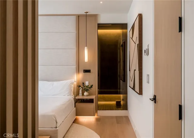 a bedroom with a large bed and a large window