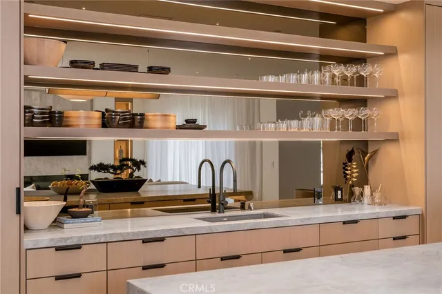 a view of living room with furniture and large windows