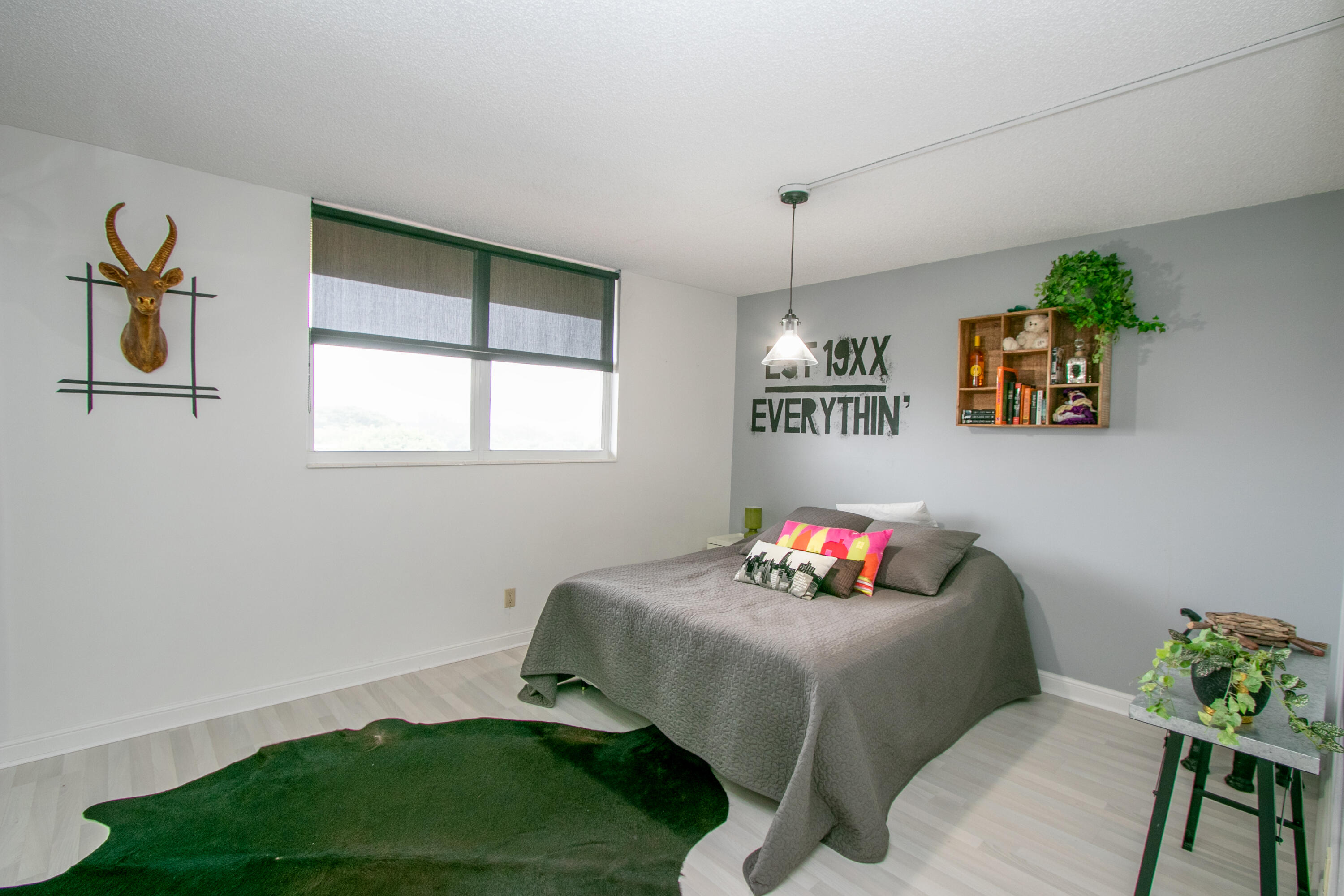 5961 Northwest 2nd Avenue, Unit 604 Boca Raton, FL 33487 - Photo 12 of 17 a living room with furniture and a window