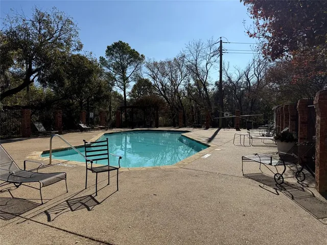 a view of a backyard with sitting area