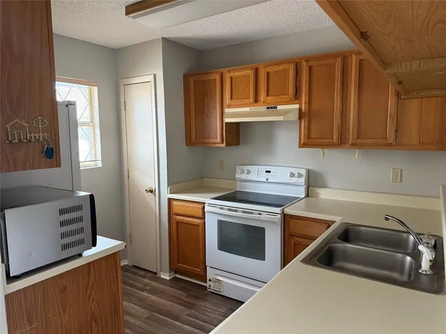 a kitchen with a stove and a sink