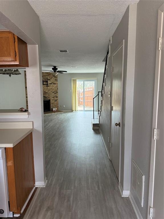 167 Merlin Way Euless, TX 76039 - Photo 5 of 18 a view of a kitchen from a hallway