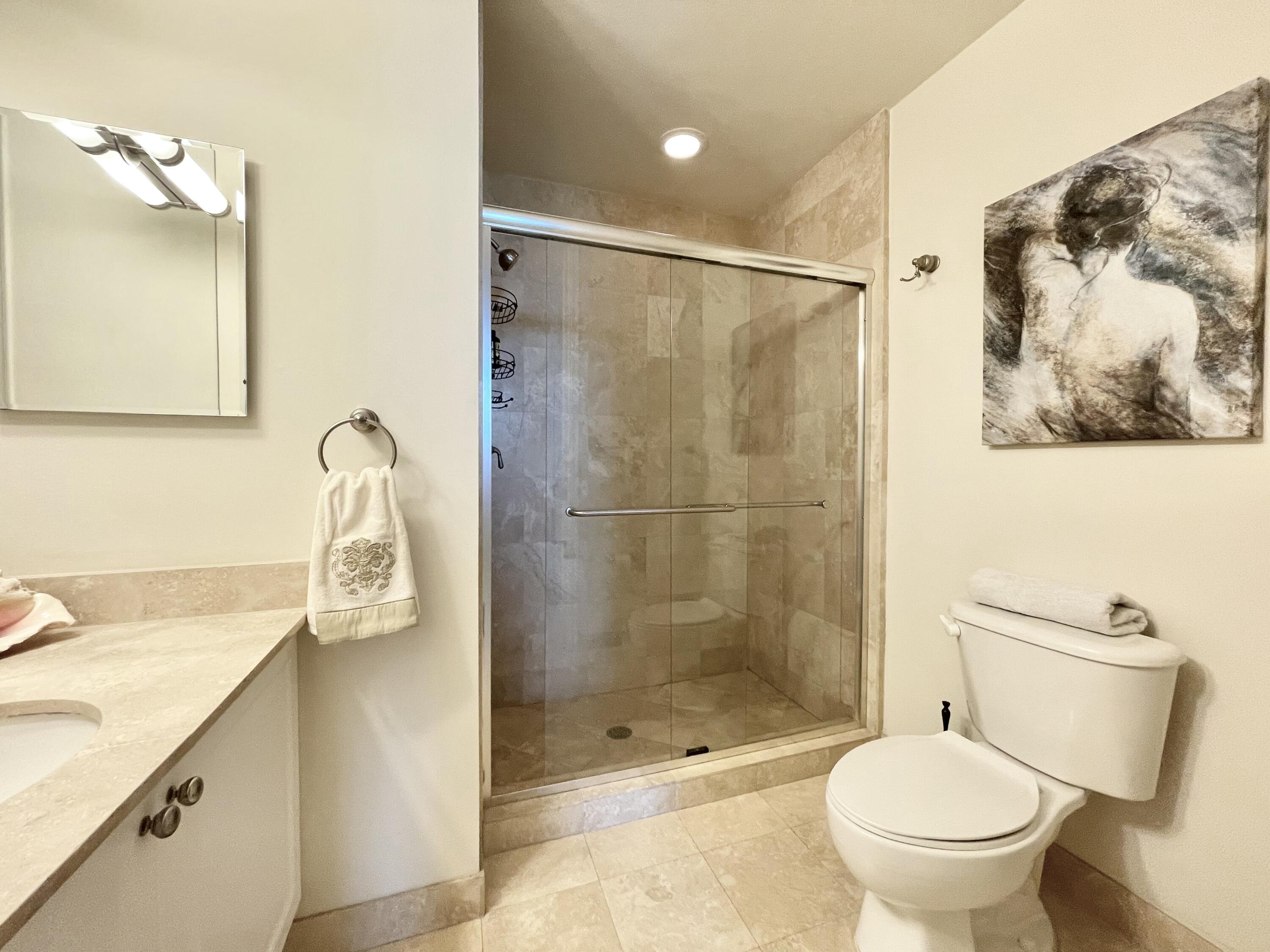 99 Southeast Mizner Boulevard, Unit 509 Boca Raton, FL 33432 - Photo 14 of 28 a bathroom with a shower and a toilet