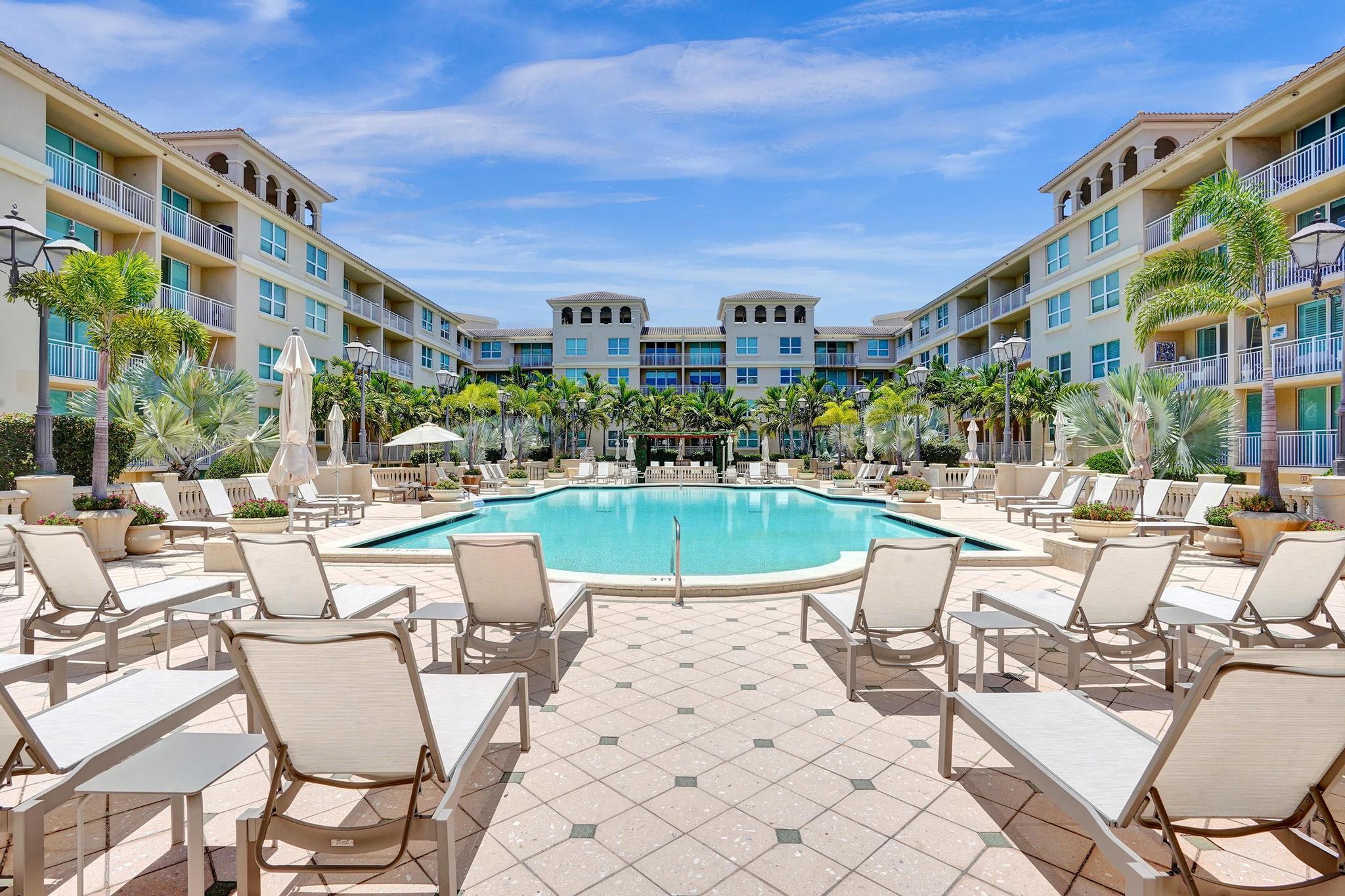 99 Southeast Mizner Boulevard, Unit 509 Boca Raton, FL 33432 - Photo 17 of 28 a view of a building with outdoor seating
