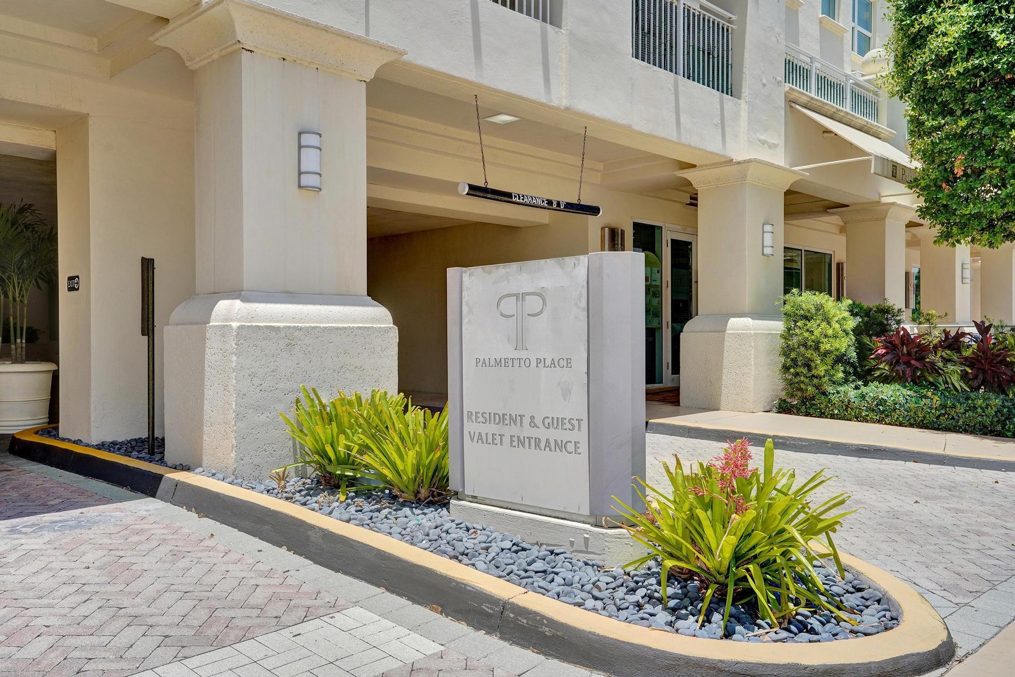 99 Southeast Mizner Boulevard, Unit 509 Boca Raton, FL 33432 - Photo 24 of 28 a front view of a house with a garden