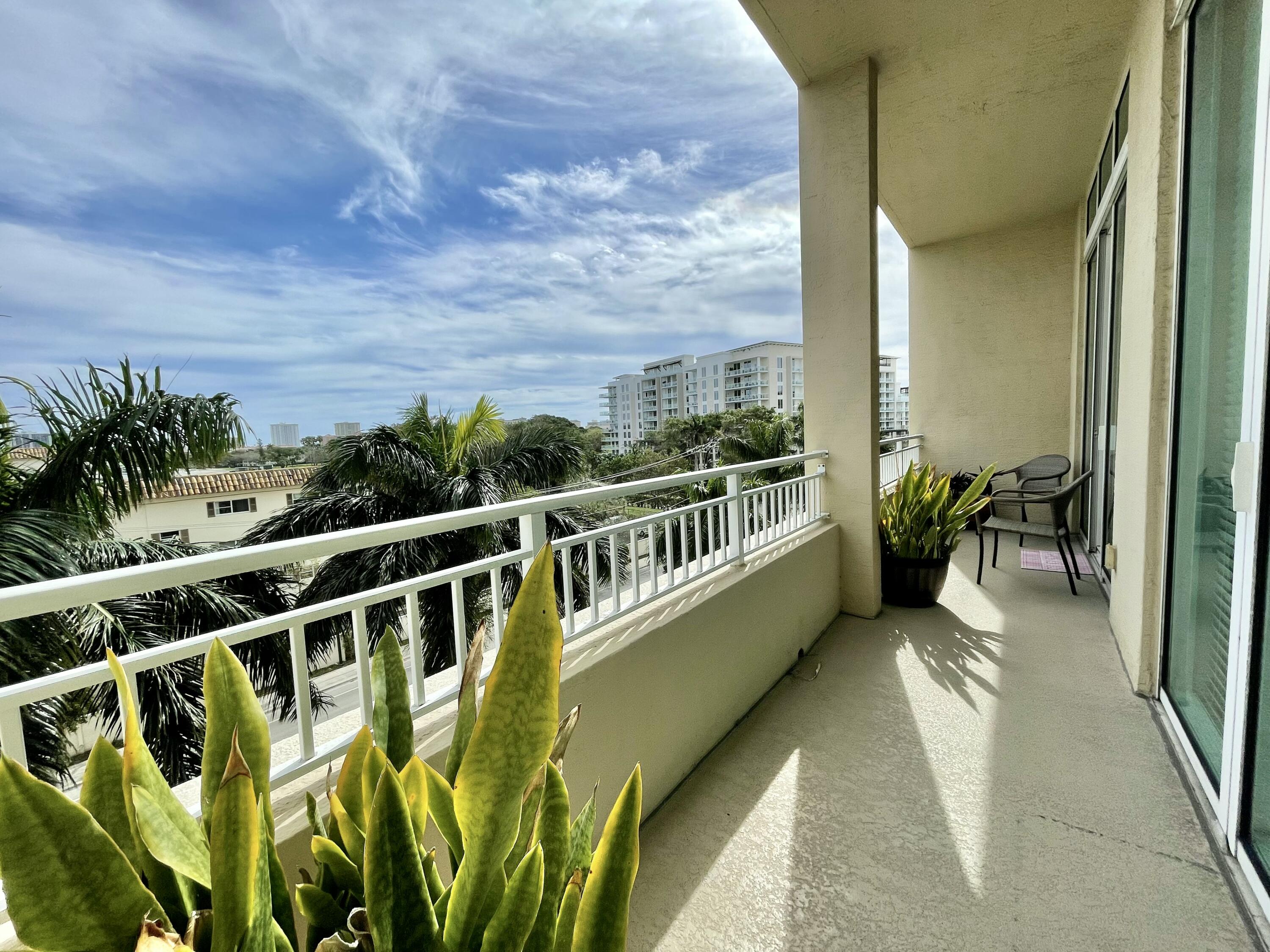 99 Southeast Mizner Boulevard, Unit 509 Boca Raton, FL 33432 - Photo 9 of 28 a view of a balcony with chairs