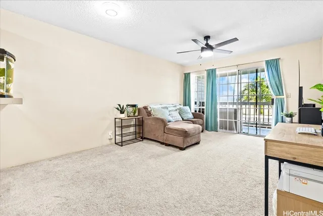 a view of a swimming pool with a yard and potted plants
