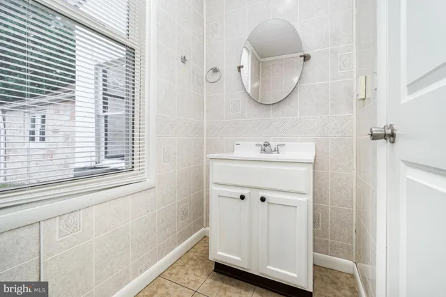 a bathroom with a sink and a window