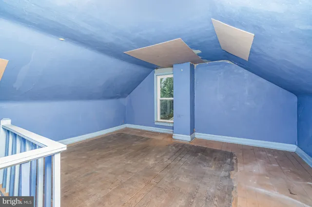 a view of an empty room with windows