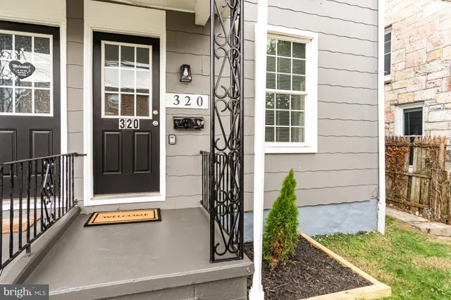 a view of a house with a large window and stairs