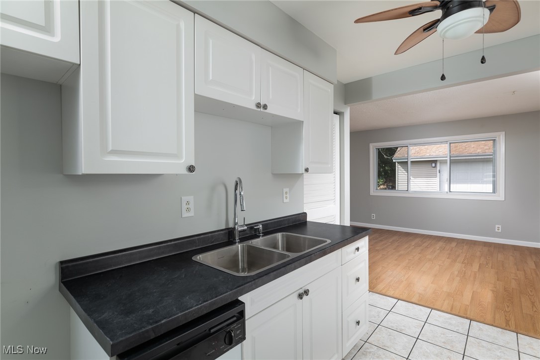 4782 Belle Meadow Road Mentor, OH 44060 - Photo 10 of 22 Kitchen featuring dishwashing machine, light hardwood / wood-style floors, white cabinets, ceiling fan, and sink