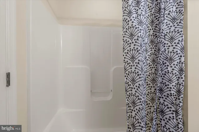 a bathroom with a shower curtain