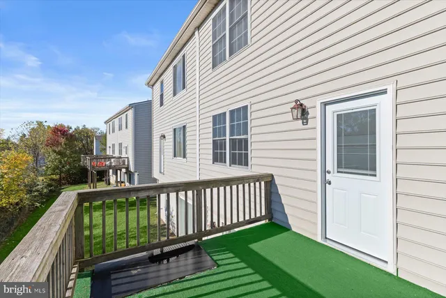 a view of a house with a small yard