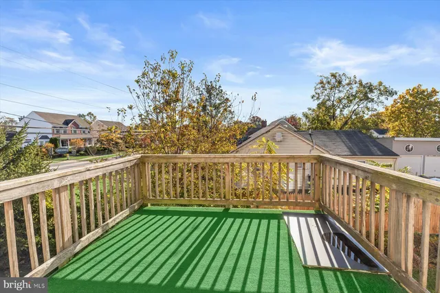 a view of a balcony with wooden floor