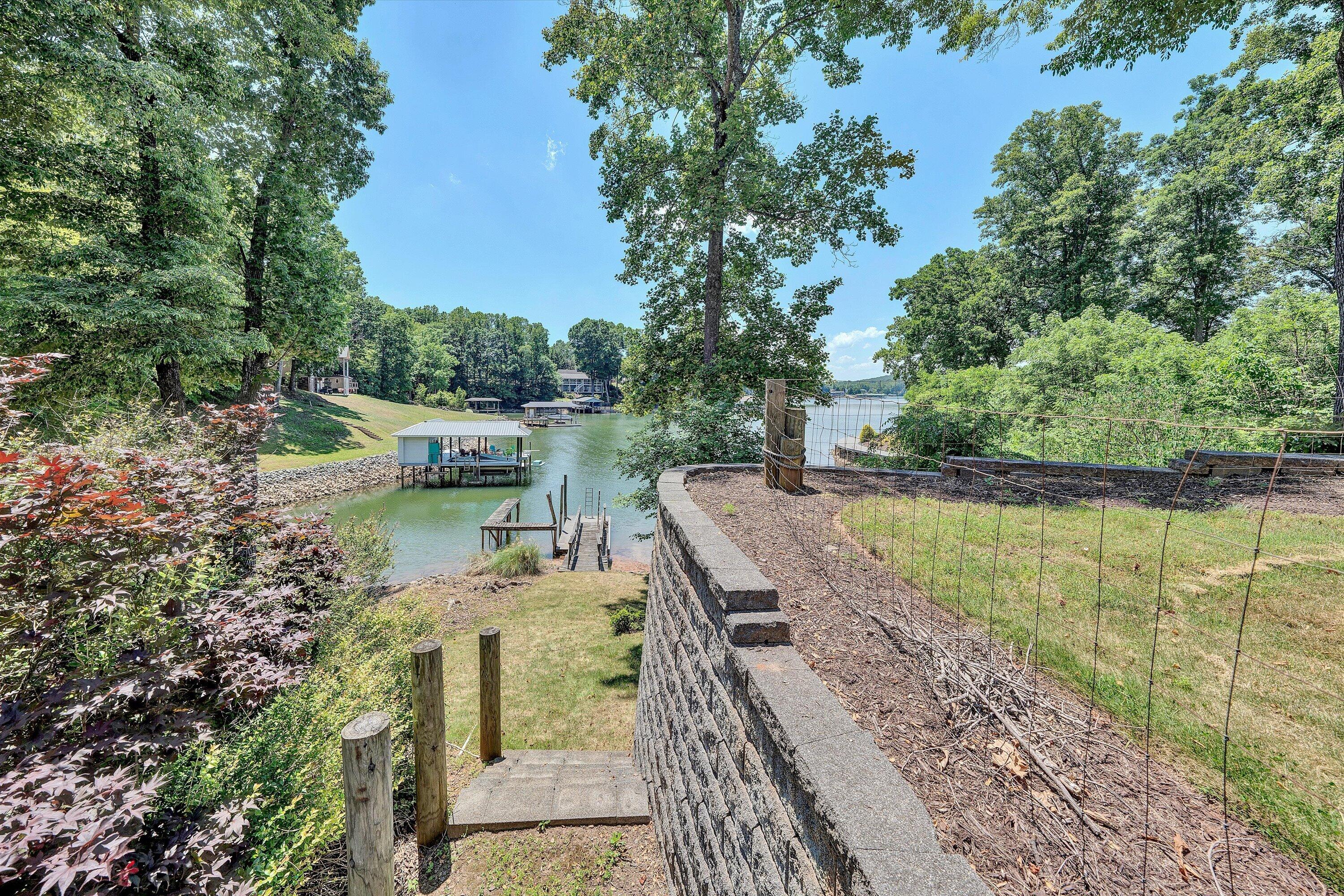 207 Winding Way Union Hall, VA 24176 - Photo 49 of 60 a view of a lake with a house in the background