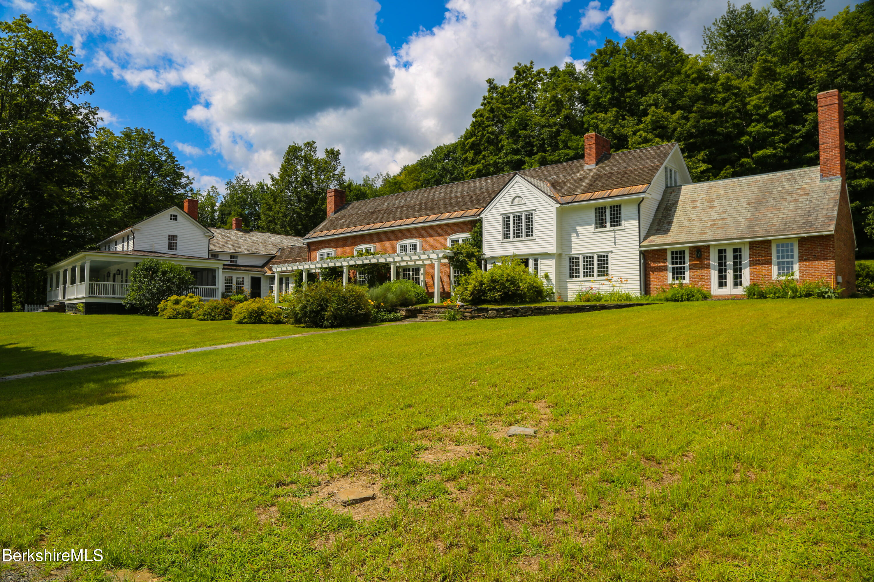 369 Bullitt Road Ashfield, MA 01330 - Photo 1 of 50 a front view of a house with a yard