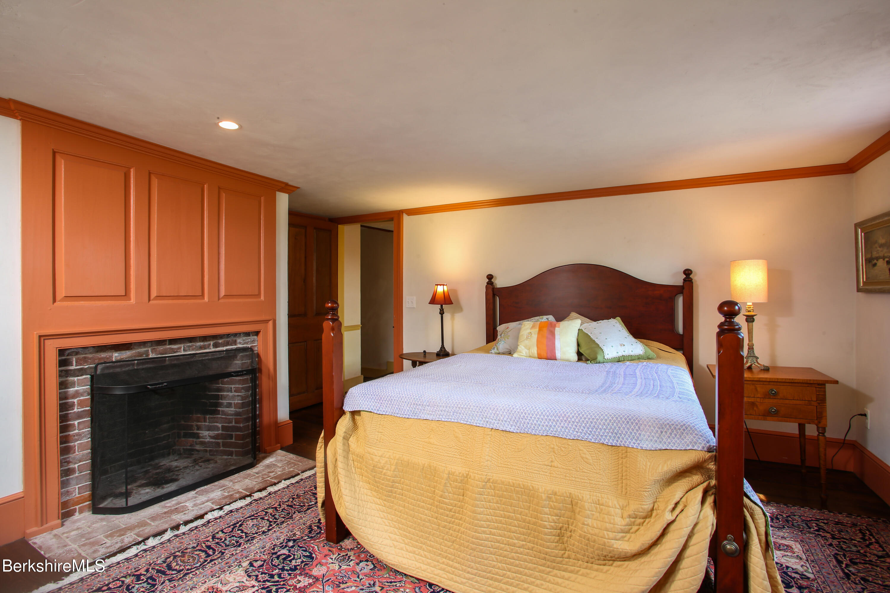 369 Bullitt Road Ashfield, MA 01330 - Photo 20 of 50 a bed room with a bed and a fireplace