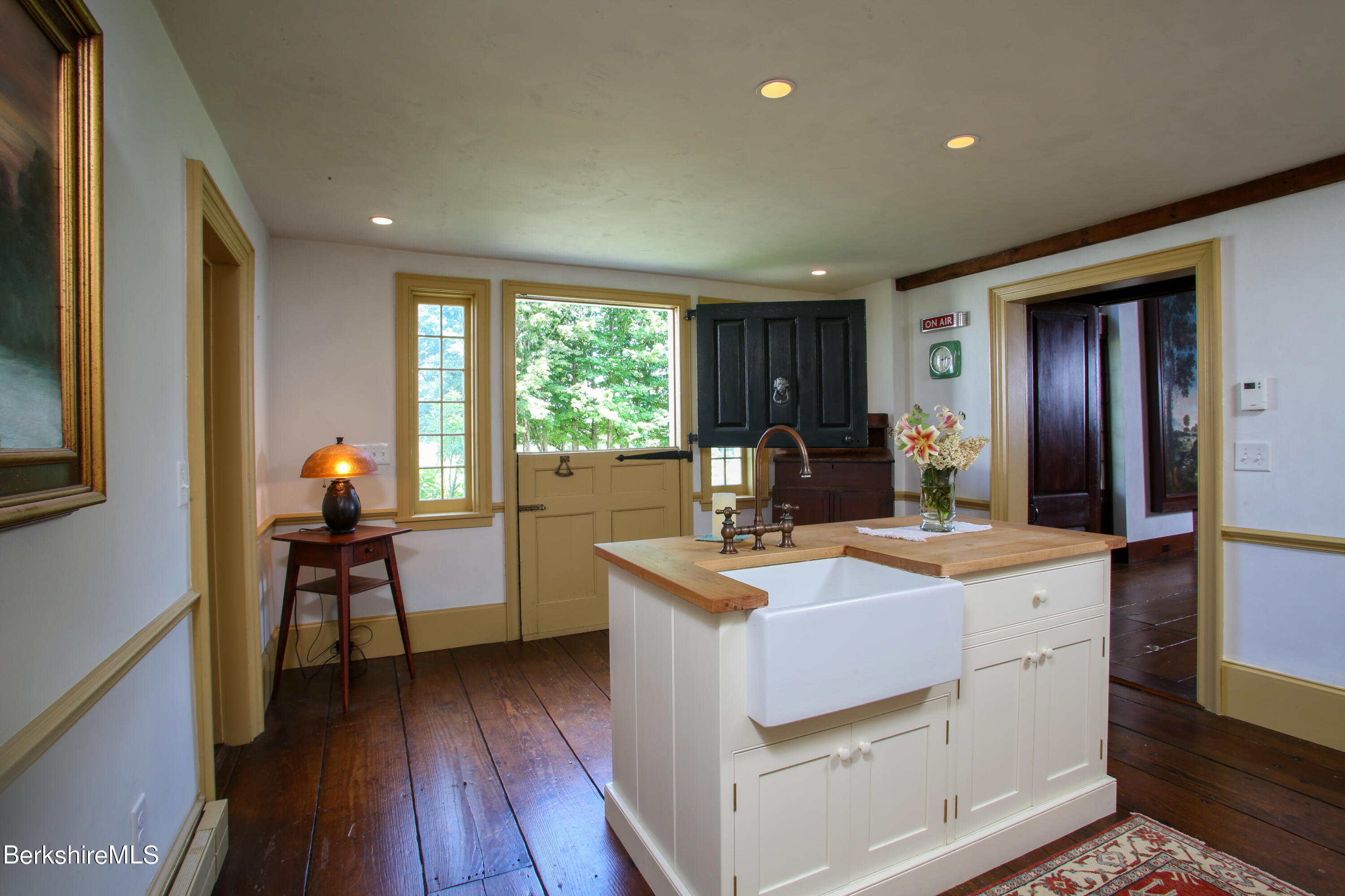 369 Bullitt Road Ashfield, MA 01330 - Photo 32 of 50 a kitchen that has a sink a stove and wooden floor