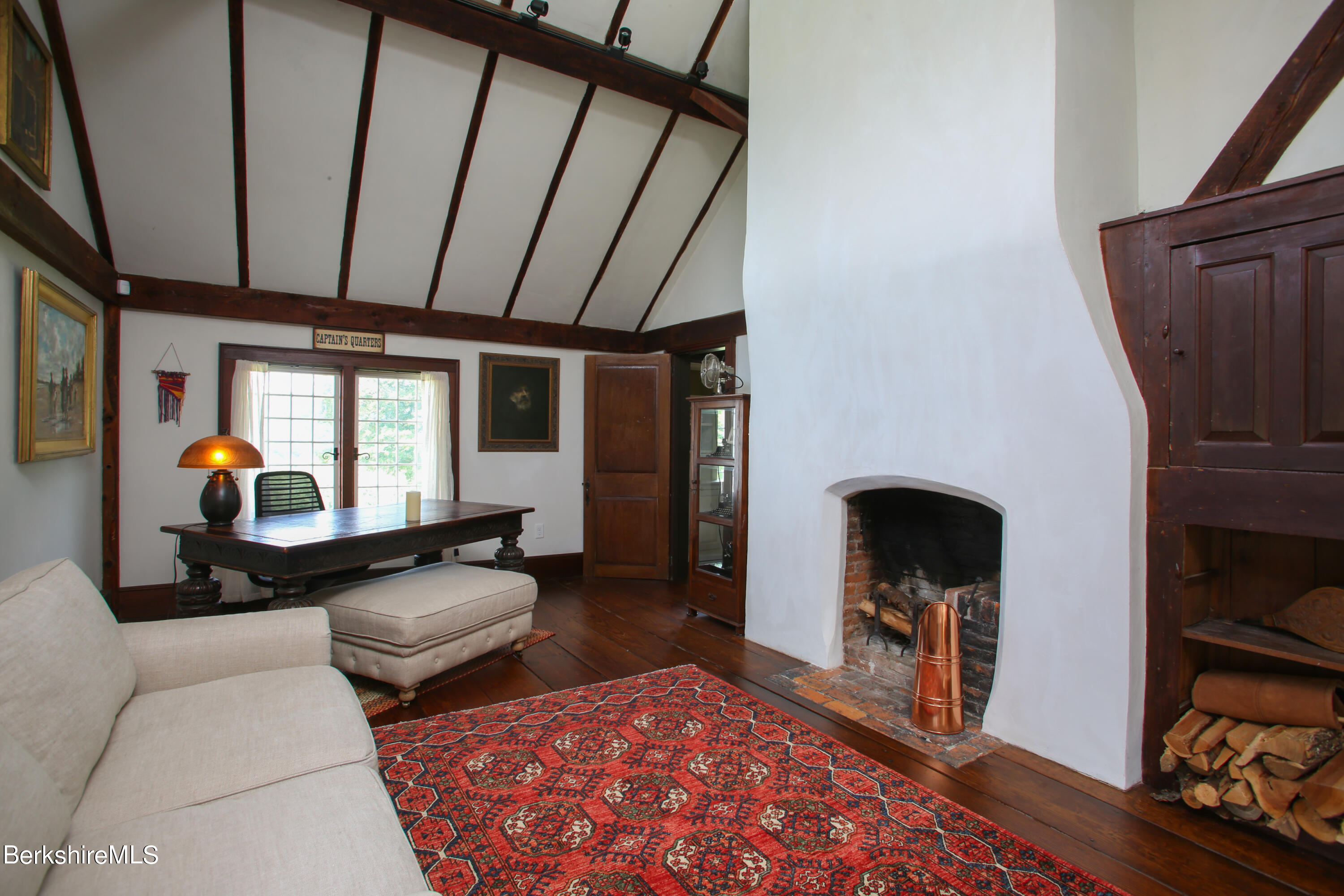 369 Bullitt Road Ashfield, MA 01330 - Photo 38 of 50 a living room with furniture and a fireplace