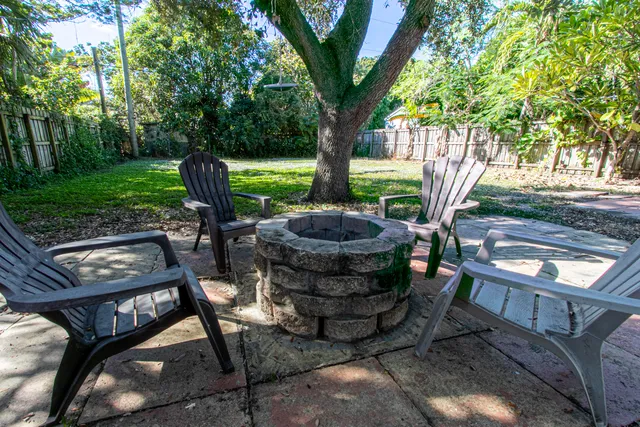 a view of house with a yard
