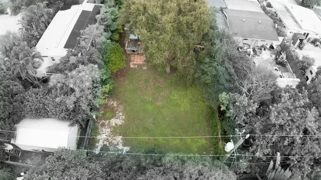 a front view of a house with a garden and plants