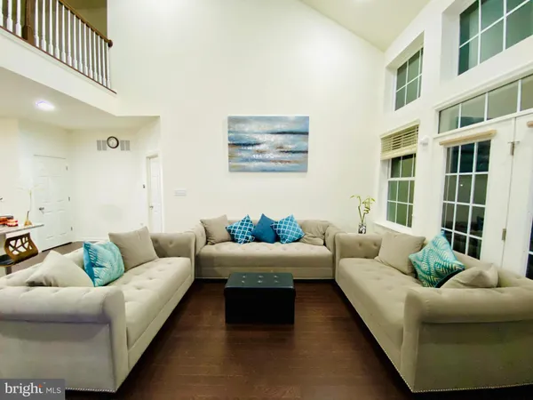 a living room with furniture and windows