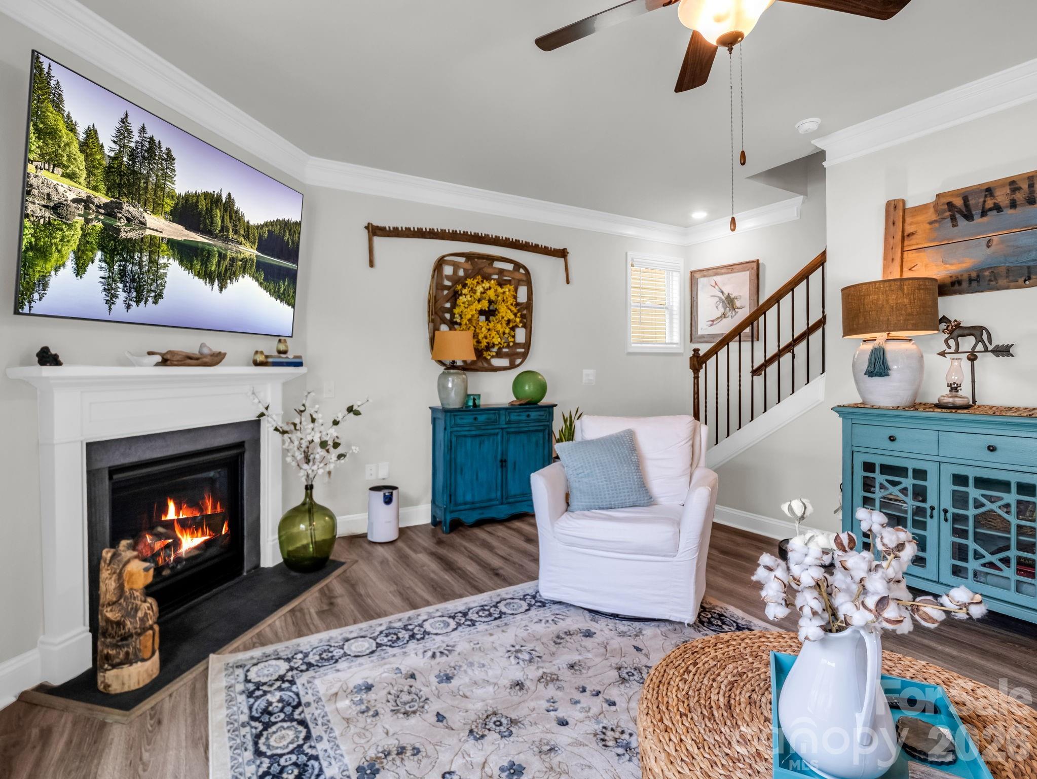 383 Fox Cove Road Hendersonville, NC 28792 - Photo 14 of 34 a living room with furniture and a fireplace