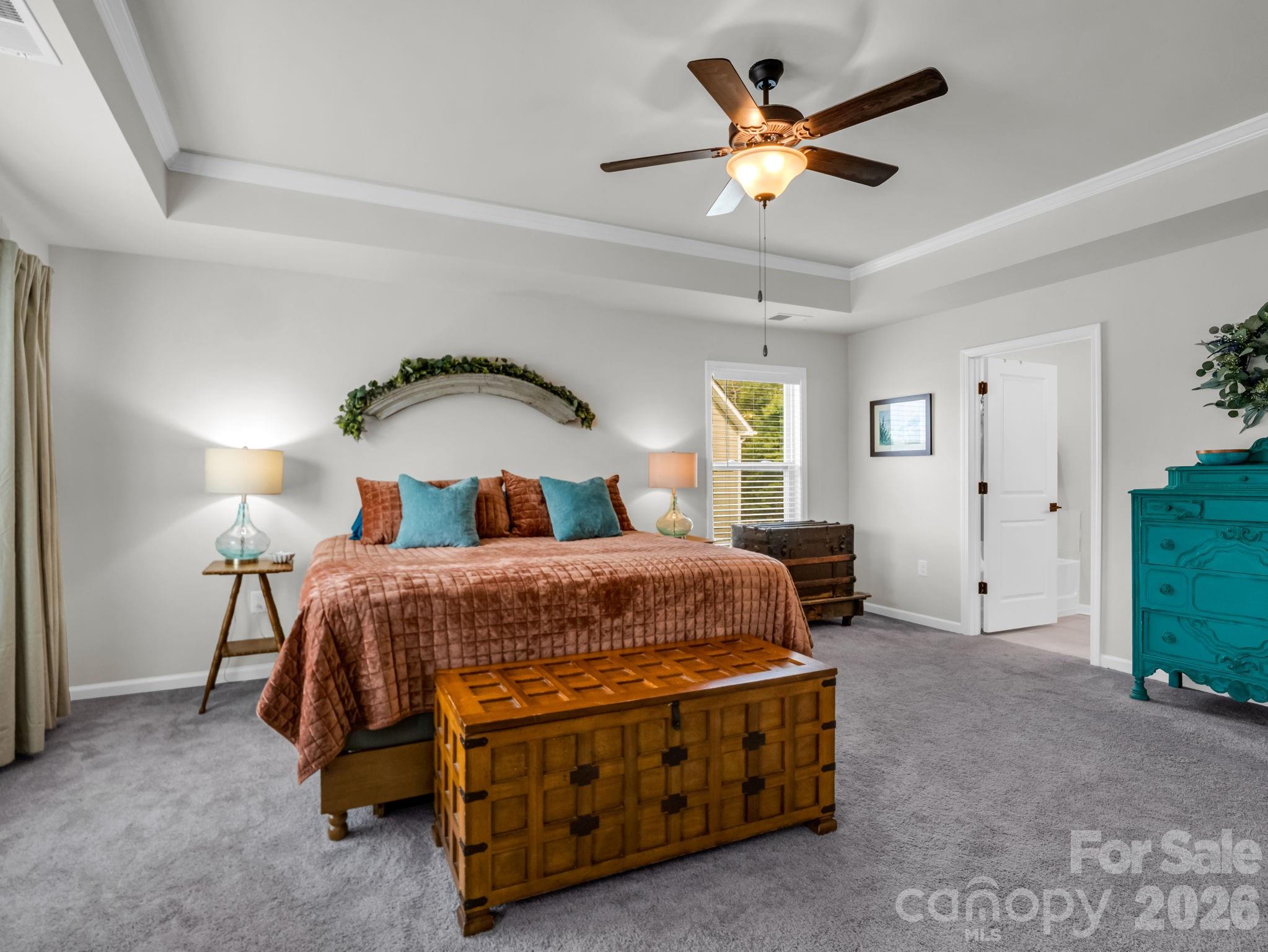 383 Fox Cove Road Hendersonville, NC 28792 - Photo 17 of 34 a bedroom with a bed and a ceiling fan