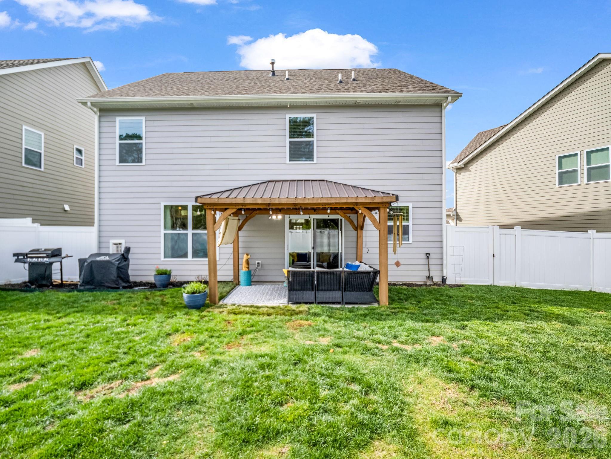 383 Fox Cove Road Hendersonville, NC 28792 - Photo 26 of 34 a view of a house with a yard and sitting area