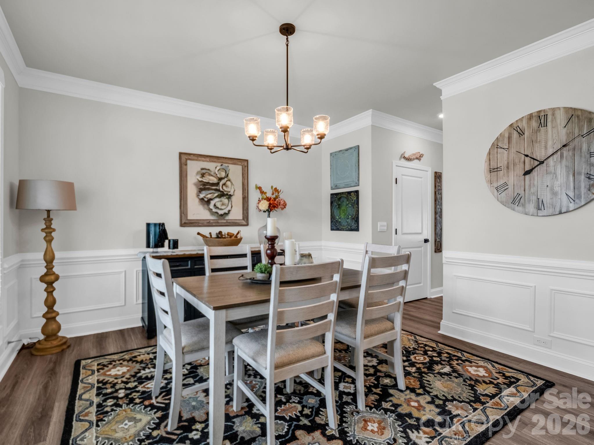 383 Fox Cove Road Hendersonville, NC 28792 - Photo 7 of 34 a view of a dining room with furniture and chandelier