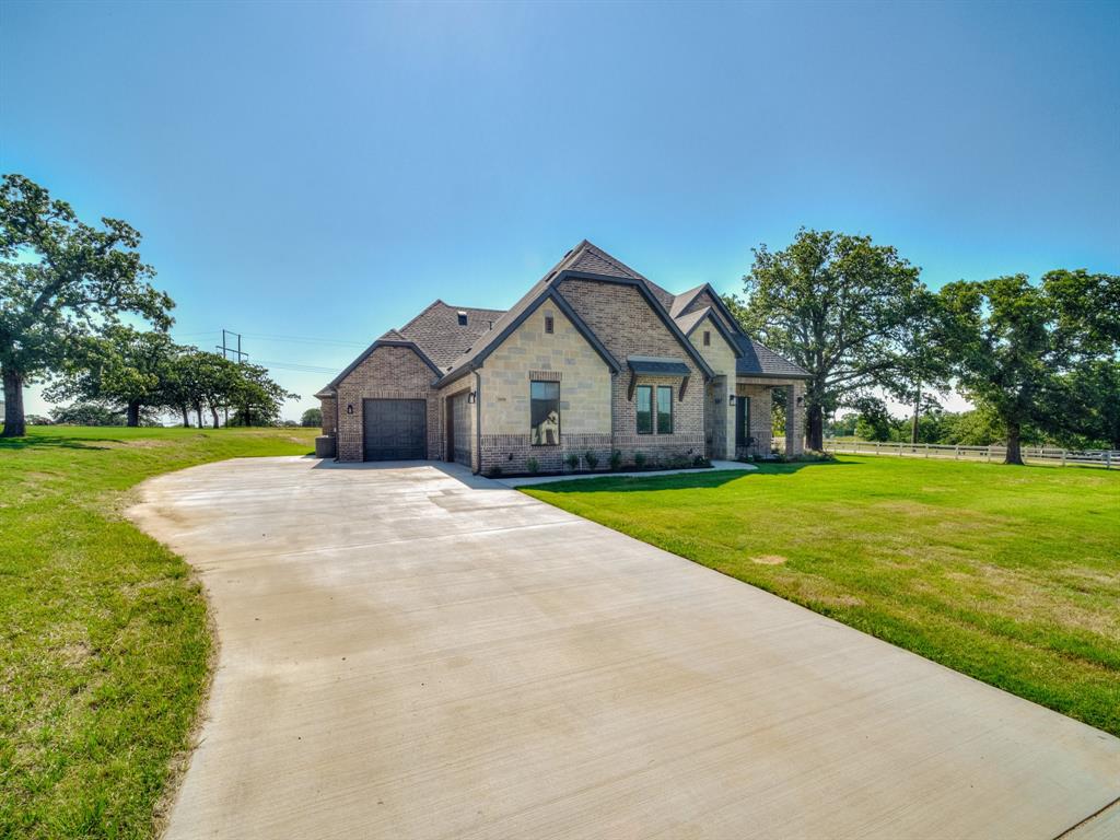 1000 Henry Way Springtown, TX 76082 - Photo 2 of 38 a front view of house with yard and green space