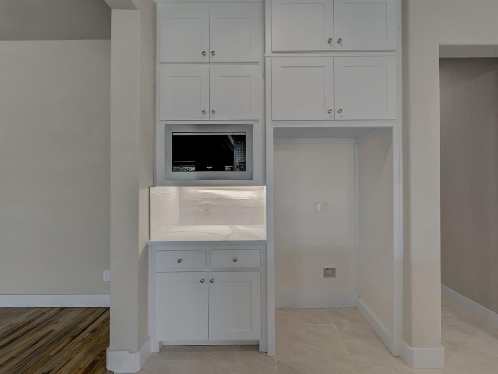 1000 Henry Way Springtown, TX 76082 - Photo 25 of 38 a kitchen with white cabinets and a sink