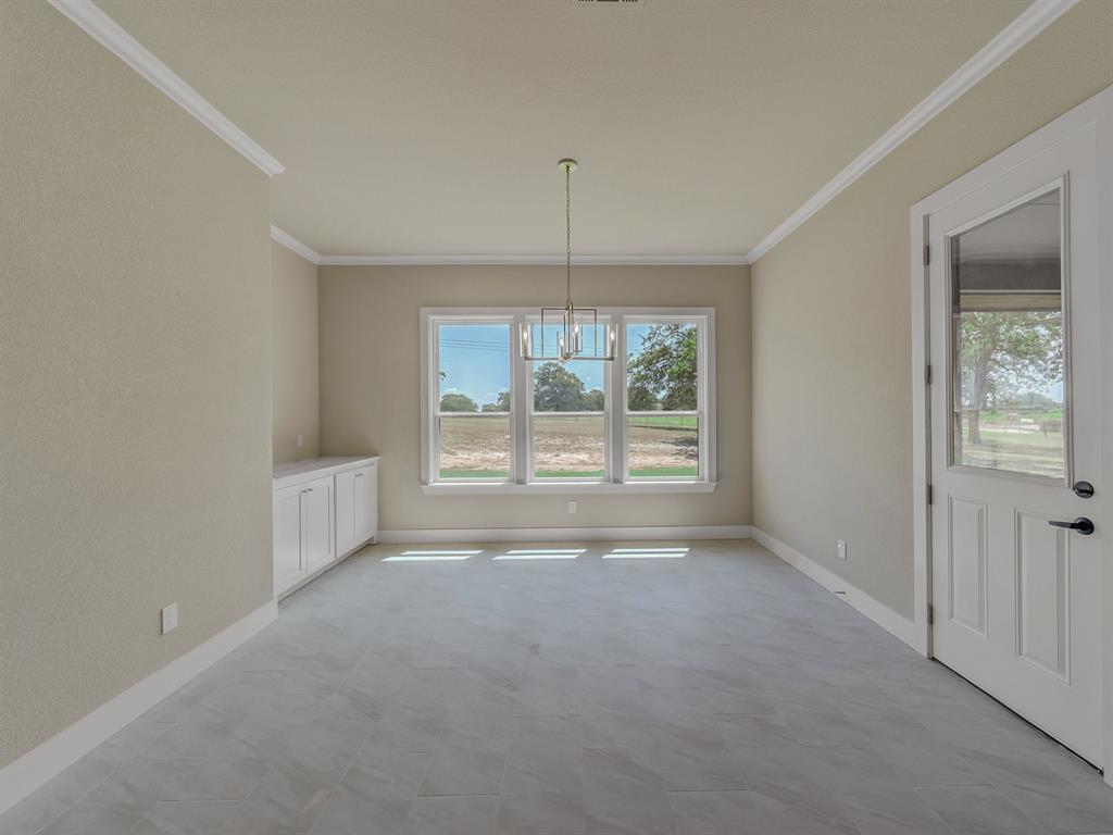 1000 Henry Way Springtown, TX 76082 - Photo 29 of 38 en empty room with windows and outdoor view
