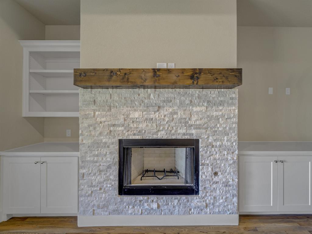 1000 Henry Way Springtown, TX 76082 - Photo 37 of 38 a stone fireplace with a fireplace
