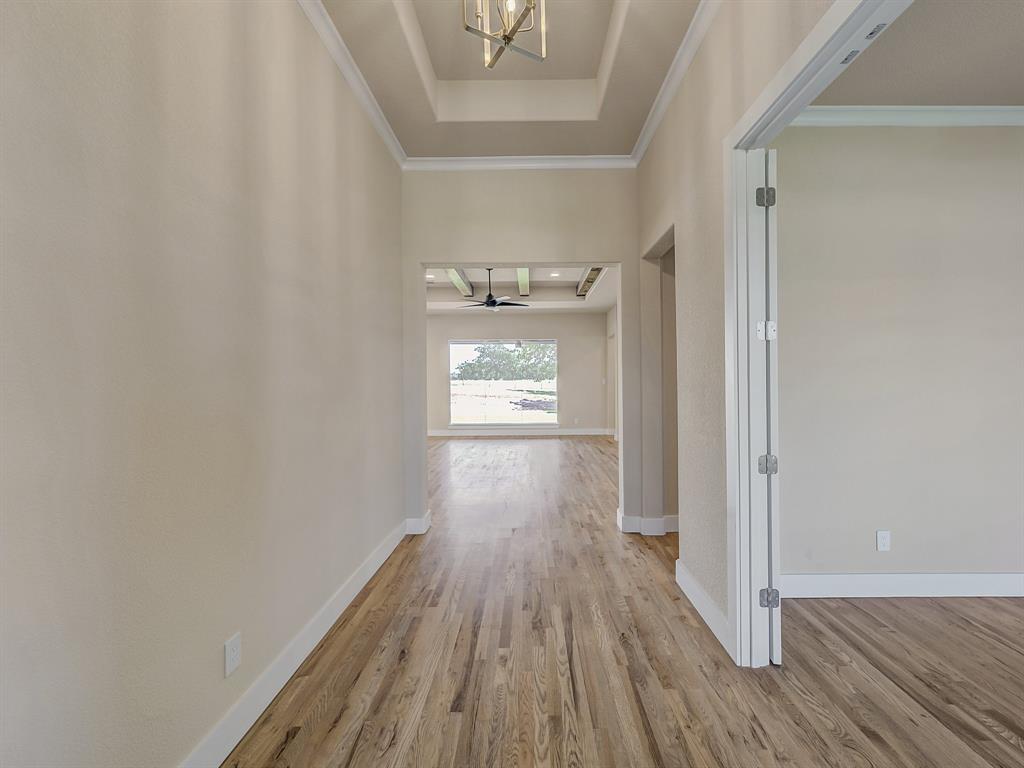 1000 Henry Way Springtown, TX 76082 - Photo 5 of 38 a view of a hallway with wooden floor