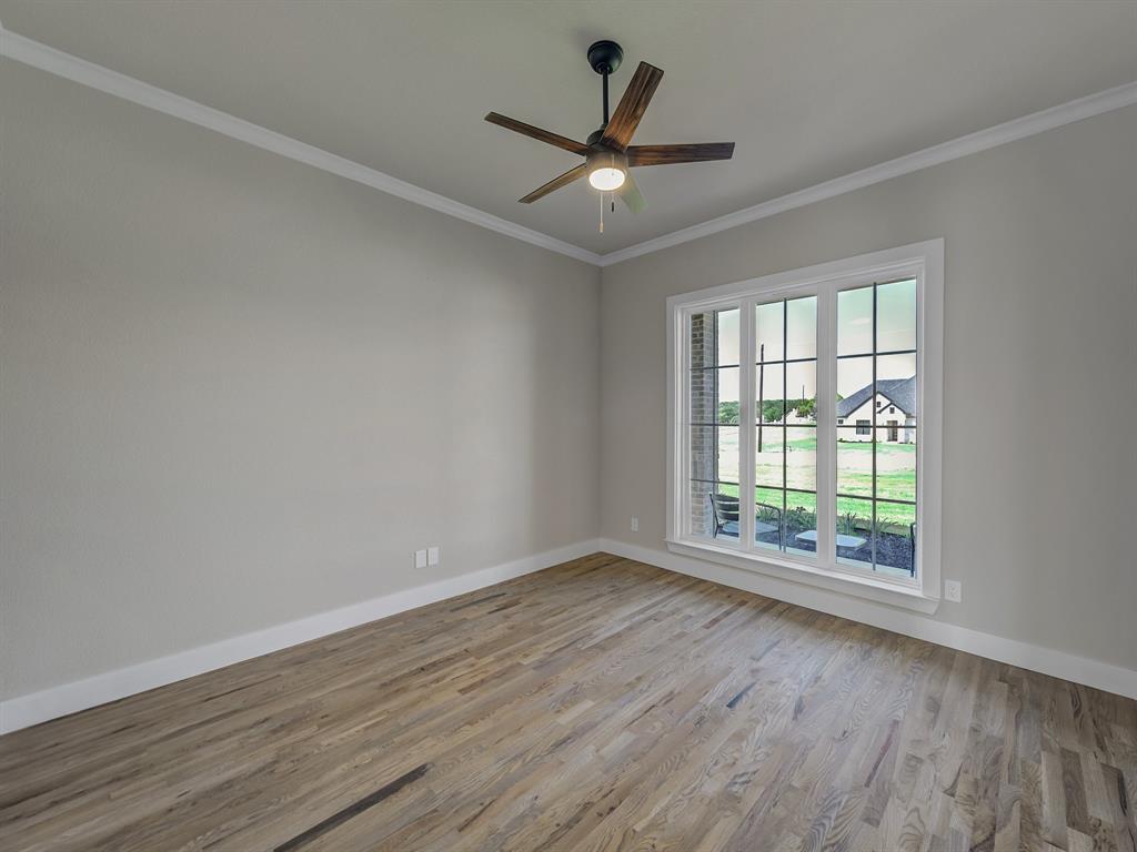 1000 Henry Way Springtown, TX 76082 - Photo 7 of 38 wooden floor in an empty room with a window