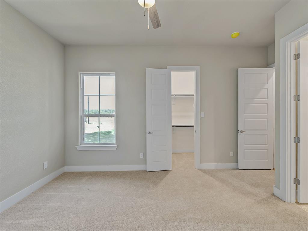 1000 Henry Way Springtown, TX 76082 - Photo 9 of 38 an empty room with windows and closet
