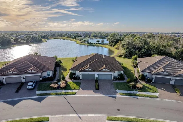 an aerial view of houses with yard