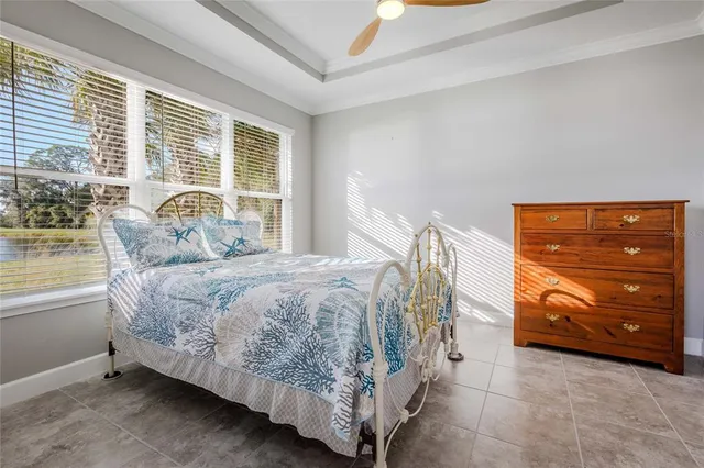 a bedroom with a bed and with windows