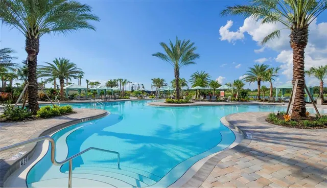 a view of a lake with a table and chairs