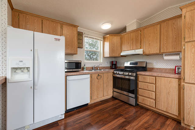 740 Riddle Drive Fredonia, AZ 86022 - Photo 4 of 20 Kitchen featuring wood-finish flooring, wood cabinetry, and a stainless steel oven/range