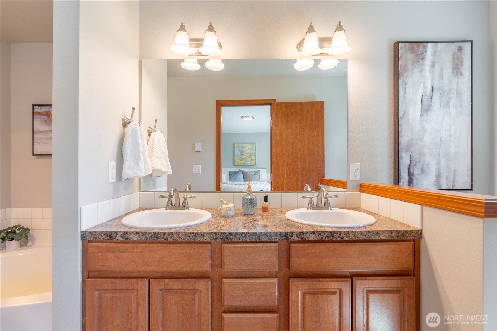 242 Riggs Drive East Enumclaw, WA 98022 - Photo 26 of 40 a bathroom with sinks granite vanity and a mirror