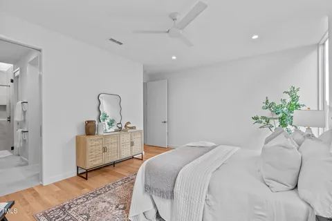 a bathroom with a double vanity sink mirror and shower