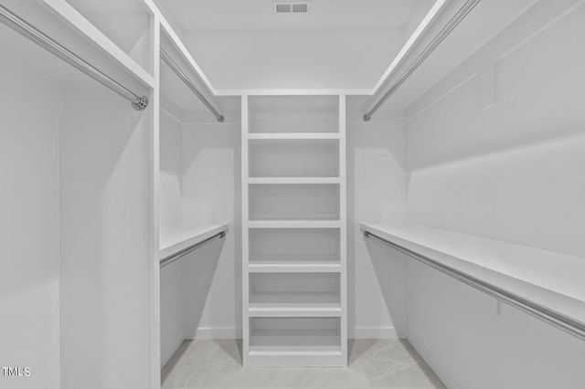 a spacious bathroom with a double vanity sink and a mirror