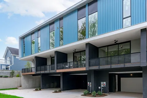 a front view of a house with a yard outdoor seating and entertaining space