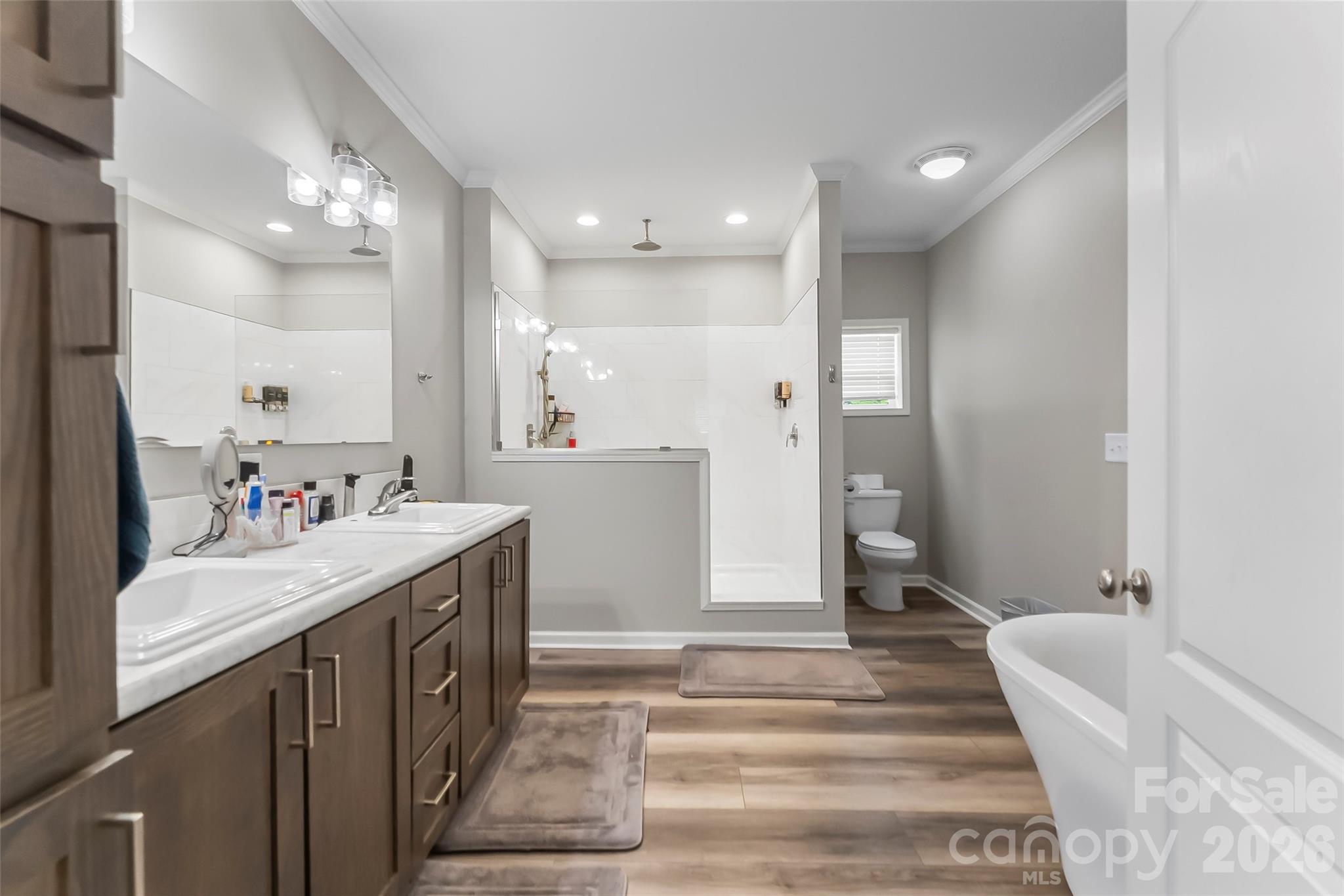 3511 Randleman Road Iron Station, NC 28080 - Photo 17 of 31 a bathroom with a sink a mirror and a shower
