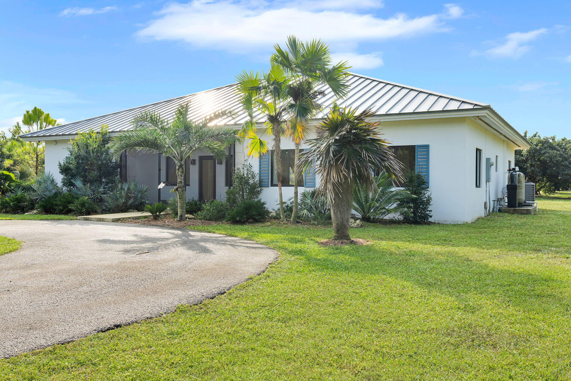 19900 Southwest 280th Street Homestead, FL 33031 - Photo 12 of 52 a front view of a house with garden
