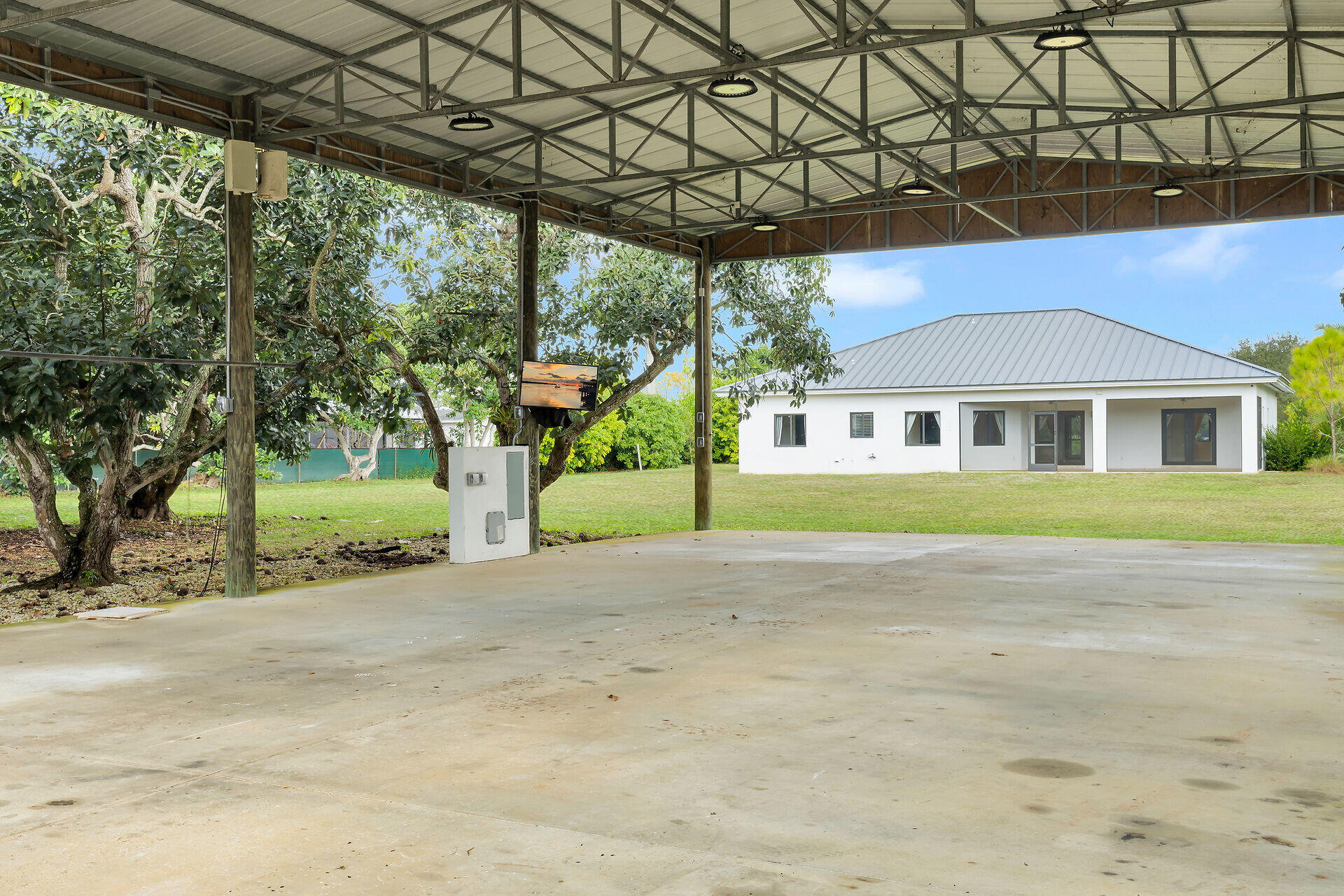 19900 Southwest 280th Street Homestead, FL 33031 - Photo 17 of 52 a house with trees in the background
