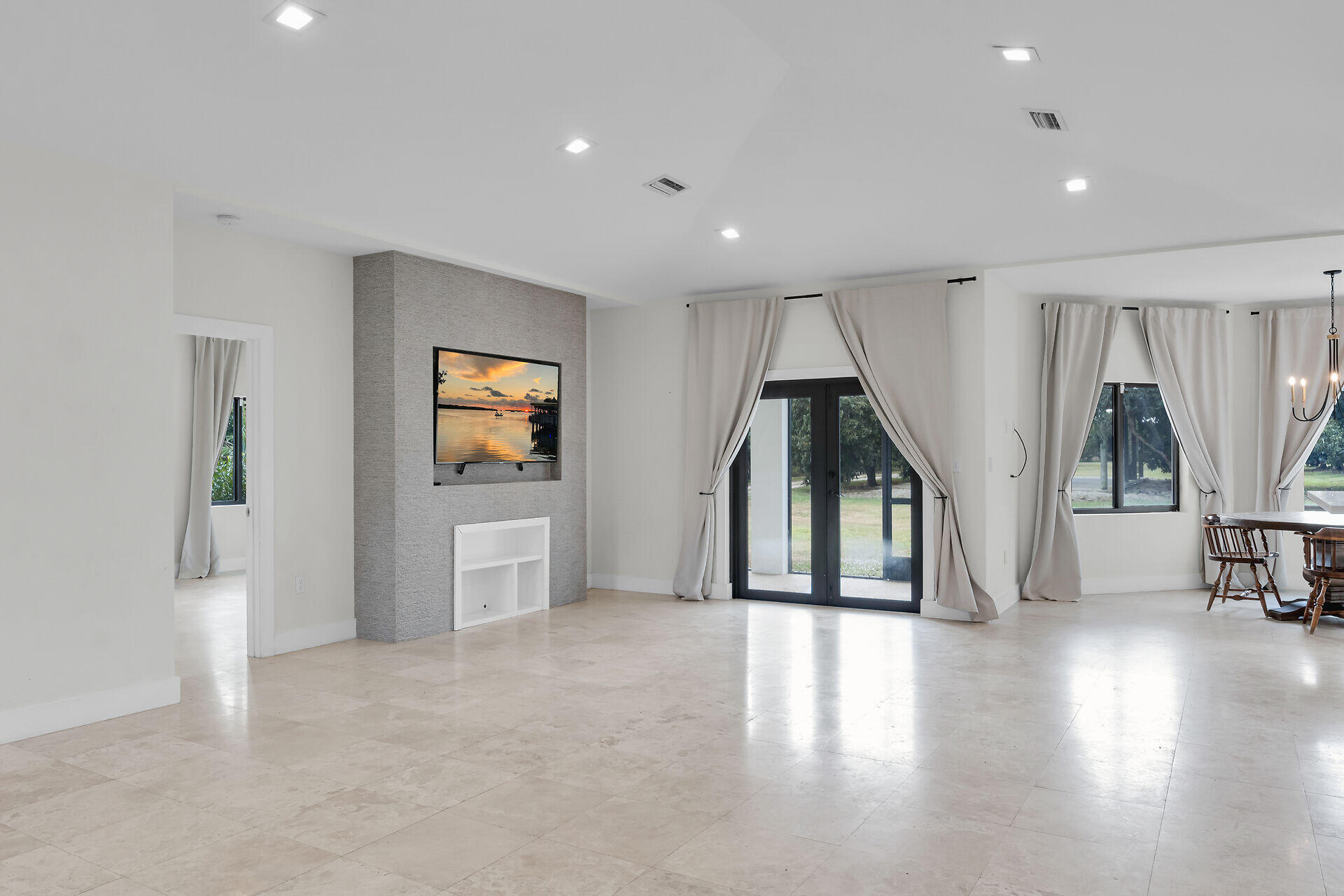 19900 Southwest 280th Street Homestead, FL 33031 - Photo 19 of 52 a view of a livingroom with an entryway and wooden floor